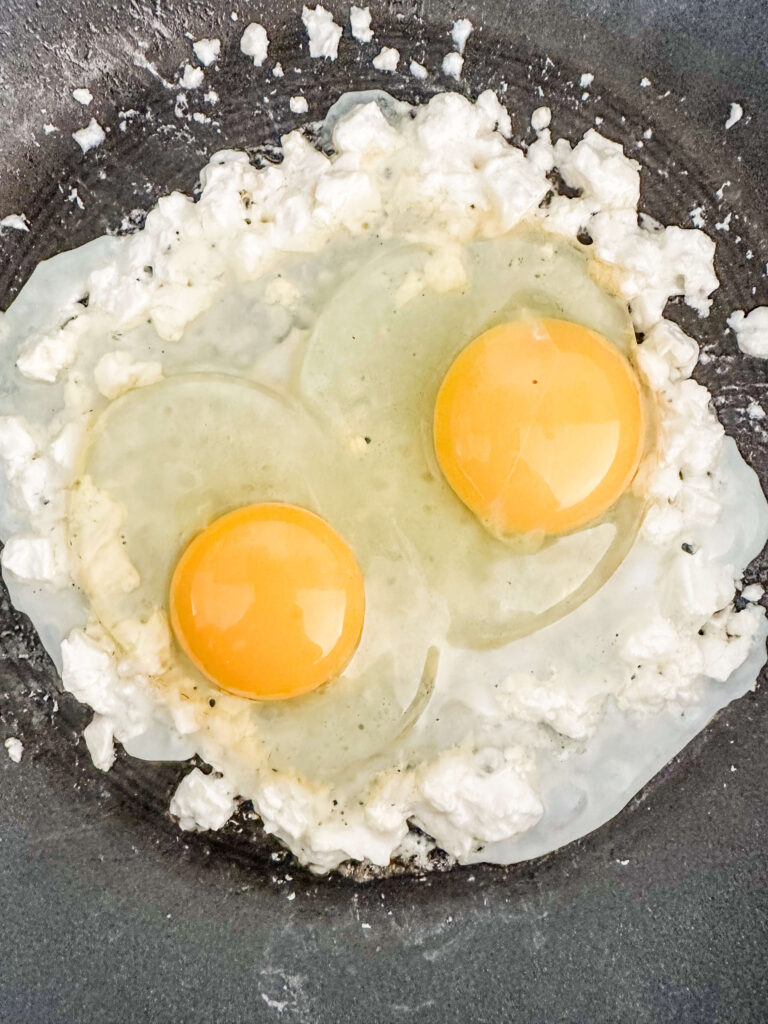 Egg and feta cheese in a pan