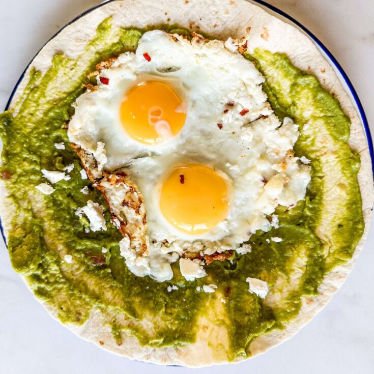 Crispy Feta Fried Eggon tortilla with guacamole